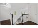 Upstairs hallway and staircase with dark hardwood floors and white trim at 238 Ivy Glen Cir, Avondale Estates, GA 30002