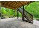 Outdoor living space with a stone patio and stairway at 3755 Valleyway Rd, Cumming, GA 30040