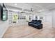 Open basement area with a built in, a ceiling fan and natural light from the windows at 3755 Valleyway Rd, Cumming, GA 30040