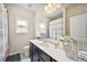 Well-lit bathroom featuring a vanity, modern fixtures, and stylish decor accents at 3755 Valleyway Rd, Cumming, GA 30040