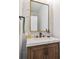 Bathroom features a decorative mirror and vanity with a white countertop at 3755 Valleyway Rd, Cumming, GA 30040