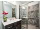 Modern bathroom with glass-enclosed shower, stylish tiles, and sleek vanity at 3755 Valleyway Rd, Cumming, GA 30040