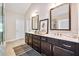 Bathroom features double sinks, a large mirror, and dark wood cabinets at 3755 Valleyway Rd, Cumming, GA 30040