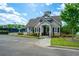 Charming community clubhouse with brick and stone exterior, surrounded by lush landscaping and nearby pool at 3755 Valleyway Rd, Cumming, GA 30040