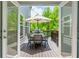 Inviting deck with outdoor seating, a grill, and a scenic view of the lush greenery at 3755 Valleyway Rd, Cumming, GA 30040