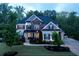 Beautiful two-story home with a well-manicured lawn and lush landscaping at 3755 Valleyway Rd, Cumming, GA 30040