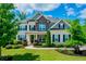 Beautiful two-story brick home with a well-manicured lawn, stone accents, and black shutters at 3755 Valleyway Rd, Cumming, GA 30040