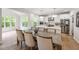 Well-appointed kitchen featuring stainless steel appliances, a large island, and a spacious dining area at 3755 Valleyway Rd, Cumming, GA 30040