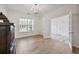 Spacious living room showcasing hardwood floors, wainscotting, and ample natural light at 3755 Valleyway Rd, Cumming, GA 30040