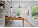 Office featuring hardwood desk, modern lighting, and views of the outdoors at 3755 Valleyway Rd, Cumming, GA 30040