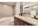 Bathroom featuring a granite countertop, modern sink, toilet, and shower over a soaking tub at 400 W Peachtree Nw St # 2614, Atlanta, GA 30308