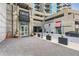 Elegant building entrance, featuring manicured landscaping, and modern architectural design at 400 W Peachtree Nw St # 2614, Atlanta, GA 30308