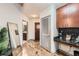 Hallway with wood flooring leads to private areas, features a convenient built-in desk and storage at 400 W Peachtree Nw St # 2614, Atlanta, GA 30308