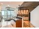Modern kitchen features an island with bar seating and updated stainless steel appliances at 400 W Peachtree Nw St # 2614, Atlanta, GA 30308