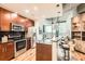 Well-equipped kitchen boasts stainless steel appliances, granite countertops, and a breakfast bar at 400 W Peachtree Nw St # 2614, Atlanta, GA 30308