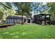 Lush green backyard featuring a trampoline and patio, surrounded by mature trees at 2100 Stone Hollow Ct, Marietta, GA 30062