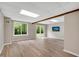 Finished basement featuring laminate flooring, large windows and a sliding glass door to yard at 2100 Stone Hollow Ct, Marietta, GA 30062