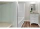 Bright bathroom featuring a tub/shower combo and a vanity with a white cabinet at 2100 Stone Hollow Ct, Marietta, GA 30062