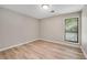 Bedroom with a window providing natural light and laminate flooring at 2100 Stone Hollow Ct, Marietta, GA 30062