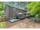 A spacious backyard featuring a deck, grill, and screened-in porch, perfect for outdoor entertaining at 4295 Parish Trce, Marietta, GA 30066