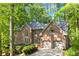 Beautiful two-story brick home with mature trees, well-maintained landscaping, and an attached two-car garage at 4295 Parish Trce, Marietta, GA 30066