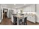 Bright kitchen features white cabinets, granite counters, and stainless steel appliances at 4295 Parish Trce, Marietta, GA 30066