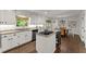 Kitchen featuring white cabinets, granite countertops, stainless steel appliances, and a eat in bar at 4295 Parish Trce, Marietta, GA 30066