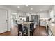 Bright kitchen features white cabinets, granite counters, and stainless steel appliances at 4295 Parish Trce, Marietta, GA 30066