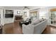 Bright, open living room with hardwood floors, fireplace, white built-ins, and plush seating at 4295 Parish Trce, Marietta, GA 30066