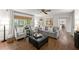 Spacious living room featuring hardwood floors, neutral paint, a comfy sofa, and views of the yard at 4295 Parish Trce, Marietta, GA 30066