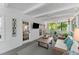 Relaxing screened porch offers a view of the wooded backyard and comfortable seating at 4295 Parish Trce, Marietta, GA 30066