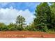 New home foundation on a sunny day with trees and sky background at 502 Charleston Pl, Villa Rica, GA 30180
