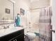Bright bathroom with a tub and shower combination, modern fixtures, and decorative accents at 3140 Willow Park Dr, Dacula, GA 30019