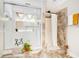 Bathroom boasting a glass enclosed shower, tiled walls, a shower curtain, and neutral colors at 3140 Willow Park Dr, Dacula, GA 30019