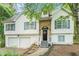 Attractive two-story home featuring a stone facade, white siding, and well-maintained landscaping at 3140 Willow Park Dr, Dacula, GA 30019