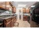 Functional kitchen featuring wood cabinets, dark countertops, and modern appliances at 3140 Willow Park Dr, Dacula, GA 30019