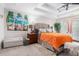 Bright main bedroom showcasing a tray ceiling, a king bed, and french doors to the backyard at 3140 Willow Park Dr, Dacula, GA 30019