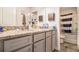 Stylish bathroom with a double vanity, granite countertop, and a shower with a striped curtain at 328 Orchid Dr, Mcdonough, GA 30252
