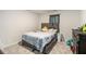 Bedroom with a modern bed, carpeted floor, and a dresser with plenty of storage space at 328 Orchid Dr, Mcdonough, GA 30252