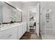Elegant bathroom with double vanity, glass shower, and stylish decor, providing a spa-like experience at 613 Stickley Oak Way, Woodstock, GA 30189