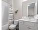 Bathroom featuring a combination tub and shower, white vanity, and grey accents at 613 Stickley Oak Way, Woodstock, GA 30189