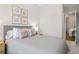 Tastefully decorated bedroom with plush carpeting and access to the hallway at 613 Stickley Oak Way, Woodstock, GA 30189