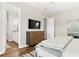 Cozy bedroom with a queen-sized bed, a large dresser, and an en-suite bathroom with updated fixtures at 613 Stickley Oak Way, Woodstock, GA 30189