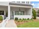 Inviting covered patio with comfortable seating area, ceiling fan, and access to the home's interior at 613 Stickley Oak Way, Woodstock, GA 30189