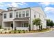 Beautifully landscaped two-story home with a covered porch and white picket fence exudes charm at 613 Stickley Oak Way, Woodstock, GA 30189