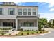 Charming two-story home with a covered porch, manicured lawn, and inviting curb appeal at 613 Stickley Oak Way, Woodstock, GA 30189