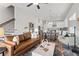 Open floor plan view showcases a living room, kitchen, dining room, and staircase at 613 Stickley Oak Way, Woodstock, GA 30189