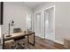 Cozy office space featuring stylish desk, chair, and wood flooring, perfect for a productive work environment at 613 Stickley Oak Way, Woodstock, GA 30189