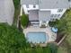 An aerial view of a home with an inground swimming pool with a meticulously landscaped backyard at 215 Haleys Ct, Woodstock, GA 30188