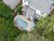 An aerial view of a home with an inground swimming pool with a meticulously landscaped backyard at 215 Haleys Ct, Woodstock, GA 30188